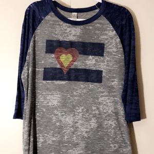 Gray and blue Colorado shirt.